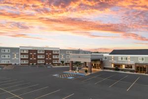 a rendering of a hotel parking lot at sunset at Four Points by Sheraton Rock Springs in Rock Springs