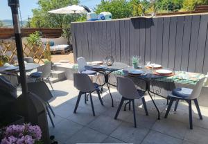 a table and chairs sitting on a patio at Havre de paix in Cluny