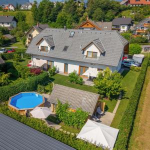 an aerial view of a house with a swimming pool at Apartments Roberta in Bled