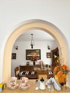 an archway leading to a bedroom with a bed at Casa in inima Bucovinei in Câmpulung Moldovenesc