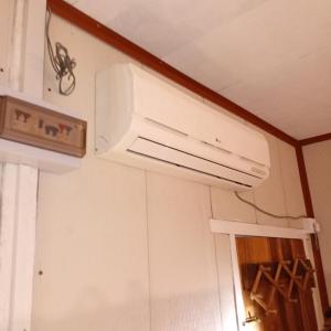a kitchen with a air conditioner hanging from the ceiling at Salt Bay Kite and Dive Resort in Kalpitiya