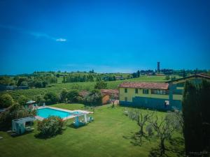 an aerial view of a house with a swimming pool at Preseglie Lake Garda in Desenzano del Garda