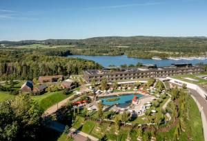 an aerial view of a resort with a lake at Seezeitlodge Hotel & Spa in Gonnesweiler