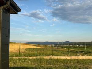 a view of a field from a fence at Green Camp Resort in Hereclean
