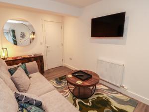 a living room with a couch and a table at Hidden Gem in Windermere +12 photos