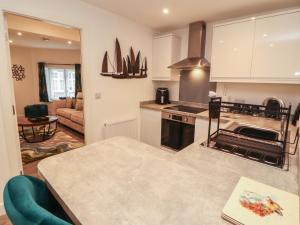 a kitchen with a counter top and a stove top oven at Hidden Gem in Windermere