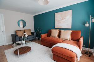 a living room with a couch and a table at The Livingston Nest in Livingston