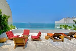 a group of chairs sitting on top of a building at Azure Loft: Sea & Luxury in Rio de Janeiro