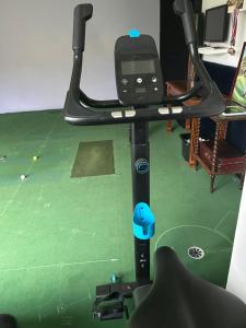 a treadmill with a tv on top of it at VILLA MESSILIA Guest Rooms French Riviera in Saint-Raphaël