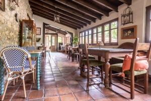 a dining room with tables and chairs at Hotel Boutique Santuario Kunturi - Adults Only by Molino de Tresgrandas in Llanes