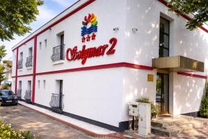 a building with a sign for a restaurant at Hotel Solymar in Mangalia