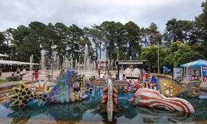 a fountain in a park with animals in the water at LouNik Kobuleti in Kobuleti