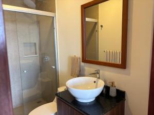 a bathroom with a white sink and a shower at San Francisco Cancun in Cancún