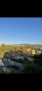 a view of a farm with a barn in a field at Haidar house in Baabda +2 photos