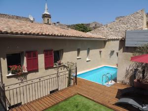 a house with a swimming pool in a yard at Eden Roque in La Roque-dʼAnthéron