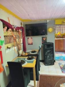 a small kitchen with a table and a stove at Movement and Reposé in Clarks Town