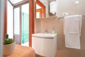 a bathroom with a sink and a mirror at Guesthouse Wish in Stari Grad +117 photos