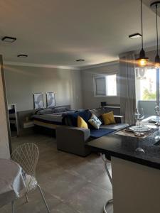 a living room with a couch and a bed at Seu espaço in Sorocaba +52 photos
