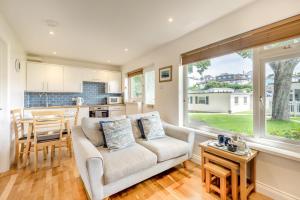 a living room with a couch and a kitchen at 2 Bed in Brixham oc-bx081 in Brixham