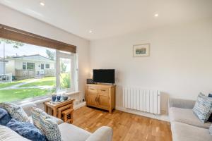 a living room with a couch and a tv at 2 Bed in Brixham oc-bx081 in Brixham