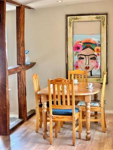 a dining room with a wooden table and chairs at Apartment Weilburg Lahnblick in Weilburg