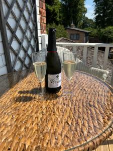 a bottle of wine and two glasses on a table at The Vicar's View at the Old Vicarage in Lincoln +21 photos