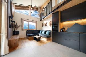 a living room with a couch and a table at Chalet Bucher in Rifiano