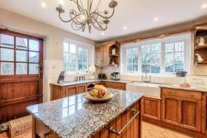 a kitchen with a bowl of fruit on a counter at 3 Bed in Lincoln oc-90396 in Washingborough