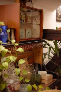 a shelf with a glass jar on a table at Das Nest Budapest in Budapest
