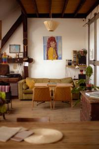 a living room with a couch and a table at Das Nest Budapest in Budapest +36 photos