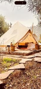 a tent that is sitting in a field at Omi Farm & Lodge in Marrakesh