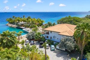 an aerial view of a resort with the ocean at Atlantis Beach House in Willemstad