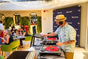 a man in a hat playing drums at a table at Hotel Indigo Florence by IHG in Florence +144 photos