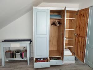a room with a closet with a white cabinet at Nyárfa Vendégház in Balatonmáriafürdő