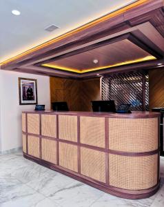 a lobby with a reception desk in a building at Zephyr Martil in Martil +16 photos