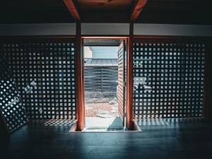 an open window in a room with an open door at ウエダハウス in Ueda