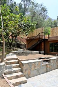 a set of stairs leading up to a house at Chatowasi Mountain Lodge in Santa Eulalia