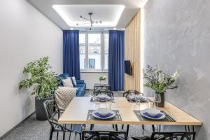 a dining room with a table and chairs at Apartmány Prusinovského in Kroměříž