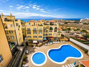 an apartment with a swimming pool and some buildings at Ocean Front Teneriffa 2 Bedroom Penthouse Costa Adeje in Callao Salvaje