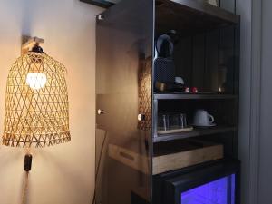 a bird cage hanging from a wall in a room at queen 24 in Taranto