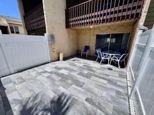 a patio with a table and chairs on it at 2BR/1BA Sienna Park Apartment in Sarasota