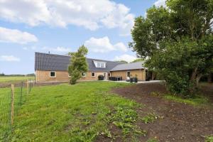 a house with a large yard in front of it at 80324-Ulfborg-Munkhulevej-6 in Staby