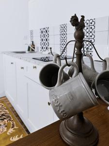a group of pots and pans on a counter in a kitchen at Le Citadin - Centre - Wifi - Balcon in Dax