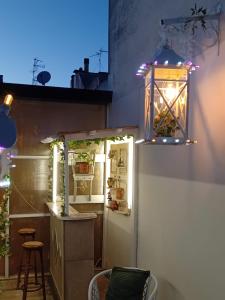 a patio with a light fixture and a refrigerator at Casa del Conte in Parabita