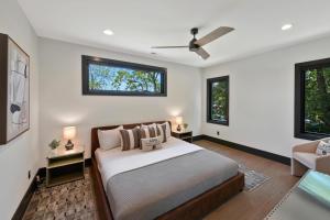 a bedroom with a bed and a couch at Willow Landing in Troutman +54 photos
