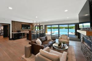 a living room with a couch and a fireplace at Willow Landing in Troutman