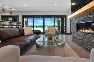 a living room with a couch and a fireplace at Willow Landing in Troutman