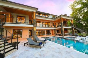an exterior view of a house with a swimming pool at Willow Landing in Troutman