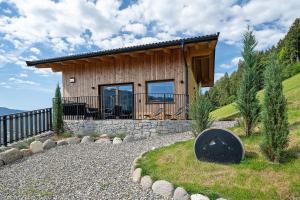 a house on a hill with a stone walkway at Chalet Bucher in Rifiano