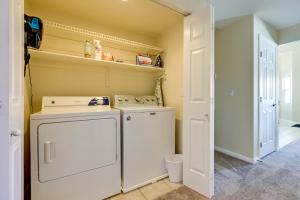 a laundry room with a washer and dryer at Golf & Gamble! Mesquite Condo w/ Pool Access in Mesquite +14 photos